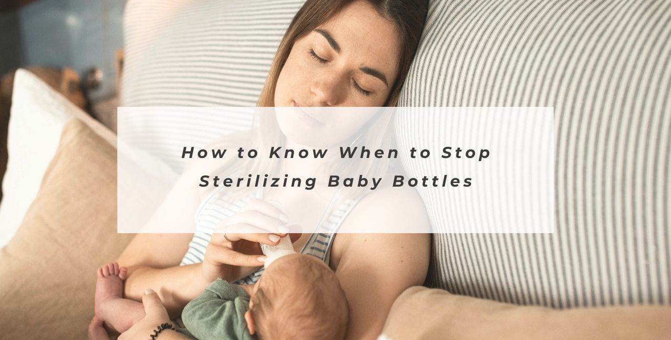 Mother feeding a baby with the text 'How to Know When to Stop Sterilizing Baby Bottles'