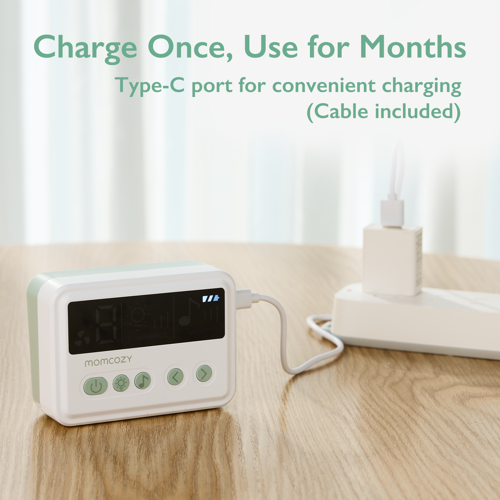 Momcozy nasal aspirator with Type-C port charging, featuring digital display for luminance and music.