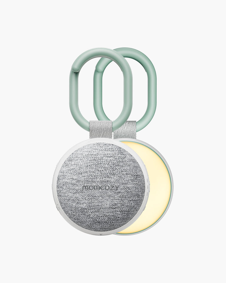 Translation missing: fr.Momcozy Portable Sound Machine featuring a light gray speaker, white frame, green handle and adjustable light function