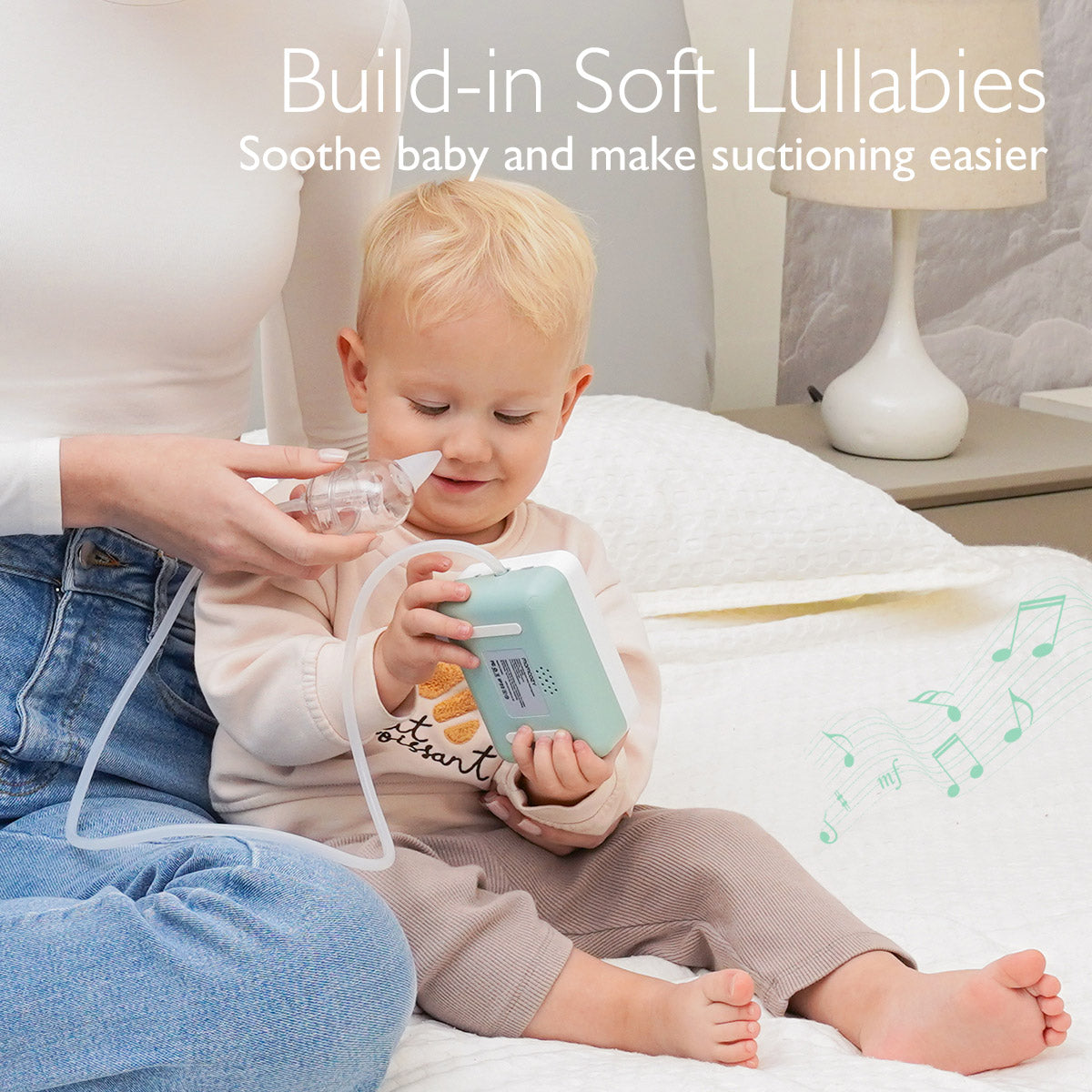 Momcozy hospital grade nasal aspirator with built-in soft lullabies soothing baby during suction.