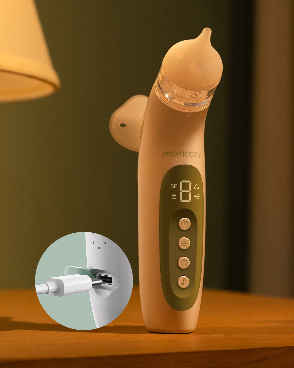Momcozy electric nasal aspirator in beige with a digital display showing '8' and USB-C charging port