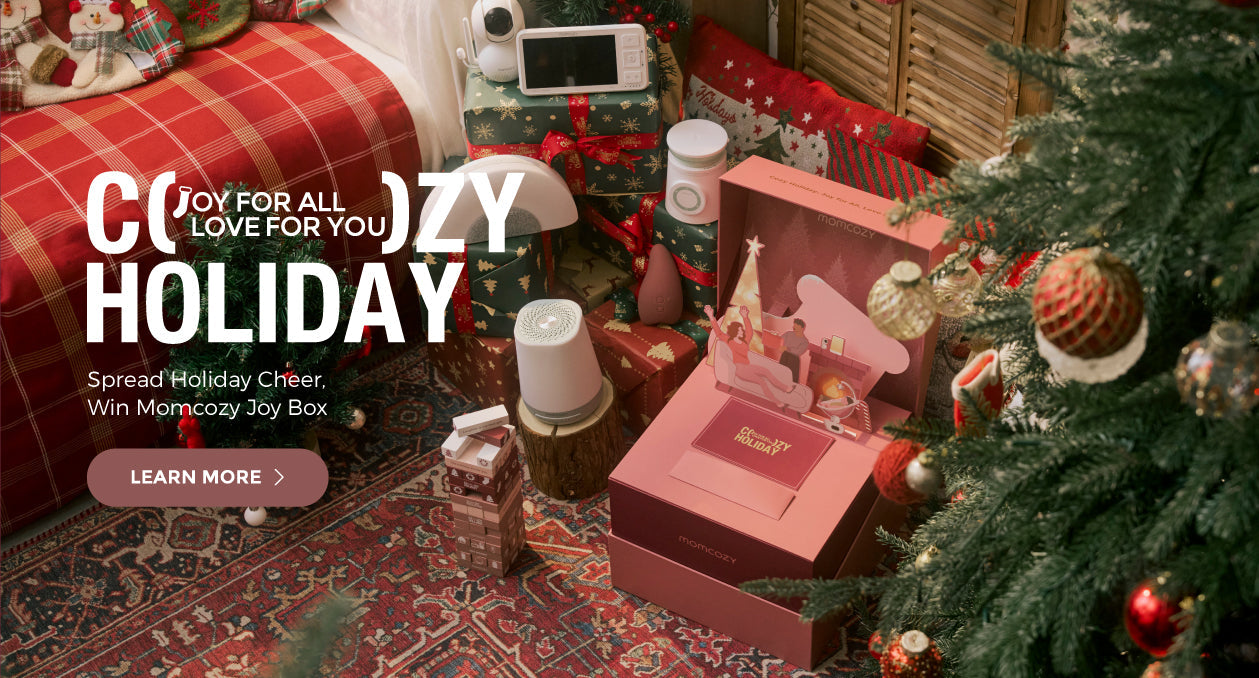 Momcozy holiday joy box under a Christmas tree