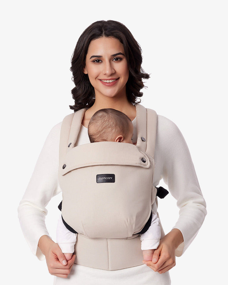 Translation missing: fr.Momcozy PureHug Baby Carrier in Khaki, showcasing a baby being carried comfortably by a mother